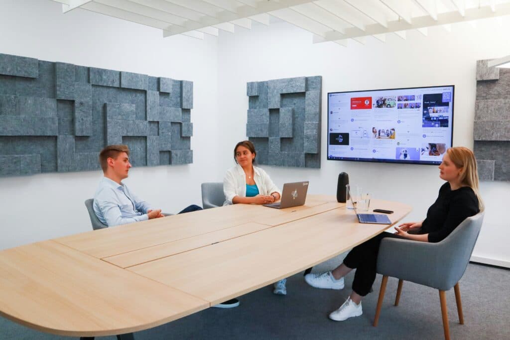 Modern boardroom with large interactive display